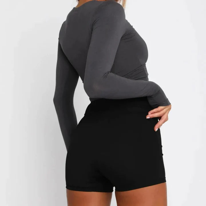 Top Slim Ana Le en polyester haute qualité, col rond et manches longues pour un look chic et confortable