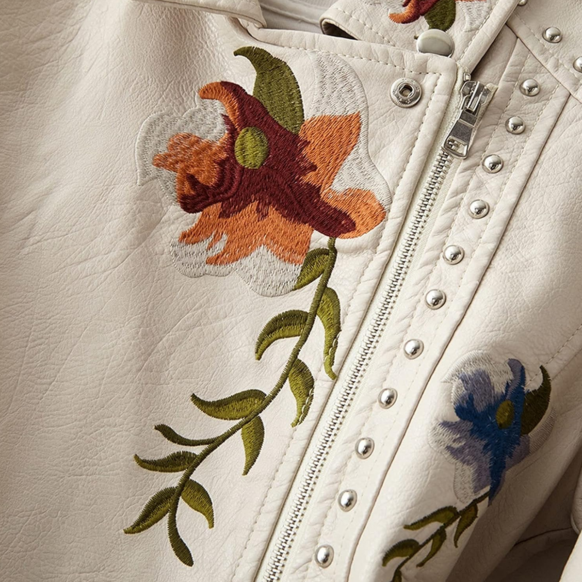 Veste en cuir audacieuse avec motifs floraux pour femme - Allure robuste et élégance moderne